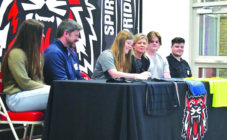 Luke Morey/The Clayton Tribune. Rabun County senior Hannah Thompson (center) signed her letter of intent to play soccer at Truett McConnell University on Wednesday, March 29. Joining Hannah are (from left), sister Grace, parents Joey and Marla, and brothers Luke and Aaron Thompson.