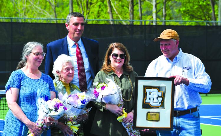 Luke Morey/The Clayton Tribune. From left, Ruth Arbitter Ebbs, Kathleen Arbitter, RGNS Head of School Jeff Miles, Jennifer Arbitter and Stephen Arbitter. During the re-dedication of Donald Arbitter tennis courts, the Arbitter family was honored with a Rabun Gap plaque in memory of Don Arbitter.