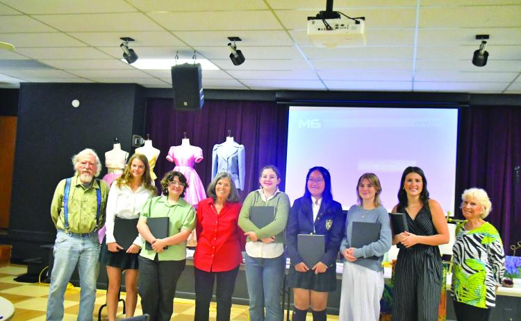At the scholarship celebration are Dietrich Hoecht, committee member (left); Kailyn Neal; Rebekah Ramey; Penny Bradley, North Georgia Arts Guild Scholarship Program committee chair; Autumn Smith; Ruichen (Sarah) Zhang; Zoey Townsend; Abigail Carver; and Kathy Beehler, committee member.