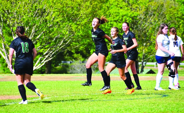 Luke Morey/The Clayton Tribune. Lady Eagle junior Georgia Mattis celebrates her goal against Asheville School on Friday, April 28.