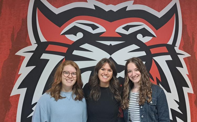 Megan Broome/The Clayton Tribune. Valedictorian Skylar Krockum, Salutatorian Bailey Maloney and Historian Hailey Hutcheson lead Rabun County’s graduating class.