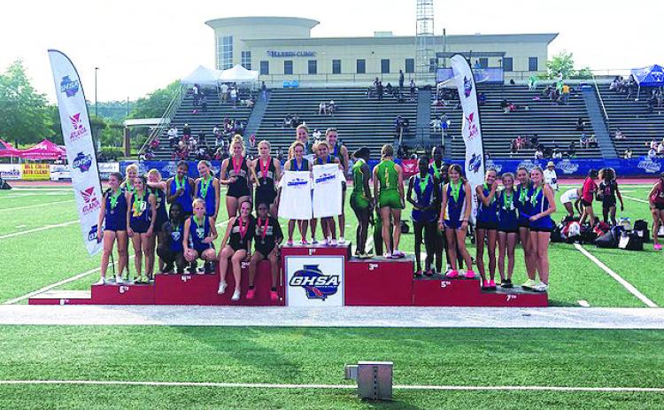 TFS photo. The Tallulah Falls School girls 4X400 relay team (center) -- composed of Dani Prince, Sofia Rueda, Molly Mitchell and Julianne Shirley -- won the state championship in Rome on May 13 with a time of 4:07.70. The Lady Indians took 10th place overall, while the Indians took 25th.