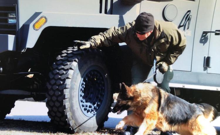 Submitted photo. K9 Handler John Crane works with partner K9 Pinda during their  law enforcement career. The pair worked as a team from 2010-2017. Pinda recently passed away at age 14.