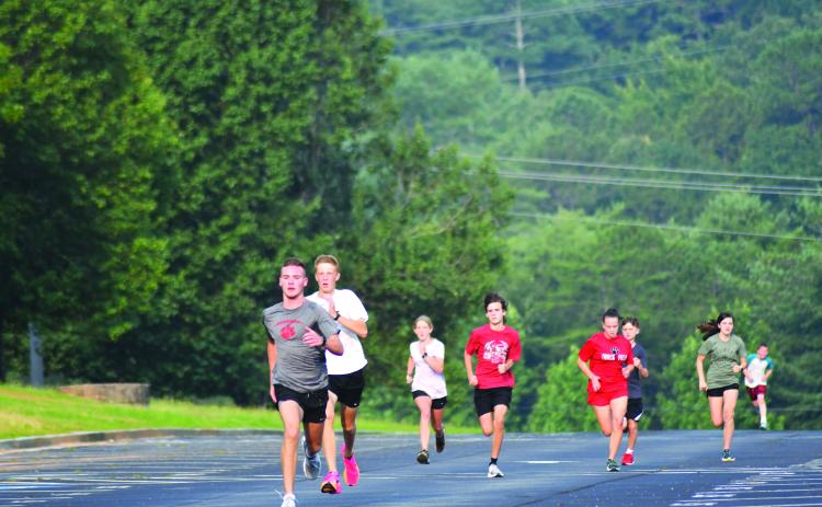 Enoch Autry/The Clayton Tribune. Hayden Smith finishes strong during the running of one of the cross country team’s 200-meter dashes.