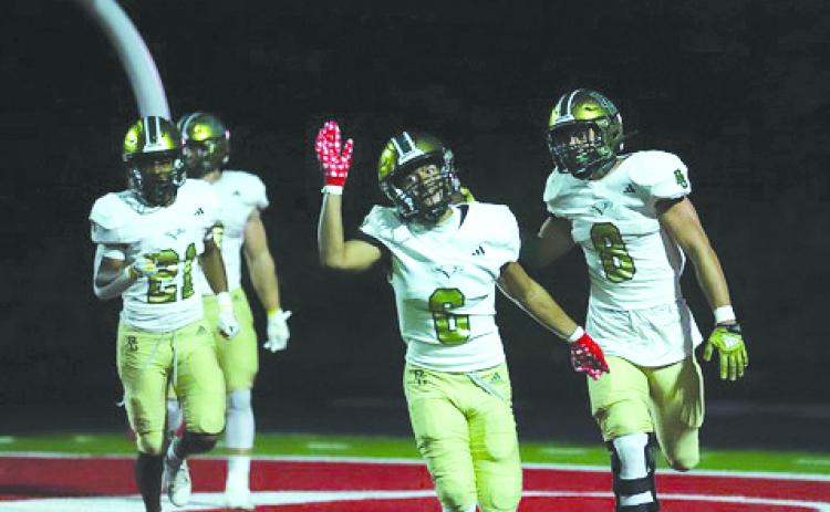 Photo courtesy Christy Kirkpatrick. Rabun Gap-Nacoochee’s Patrick Williams (6) celebrates the Eagles’ scoop-and-score that led to the RGNS 35-24 over nationally ranked Baylor in Chattanooga on Aug. 18. The Eagles are at home on Aug. 25.