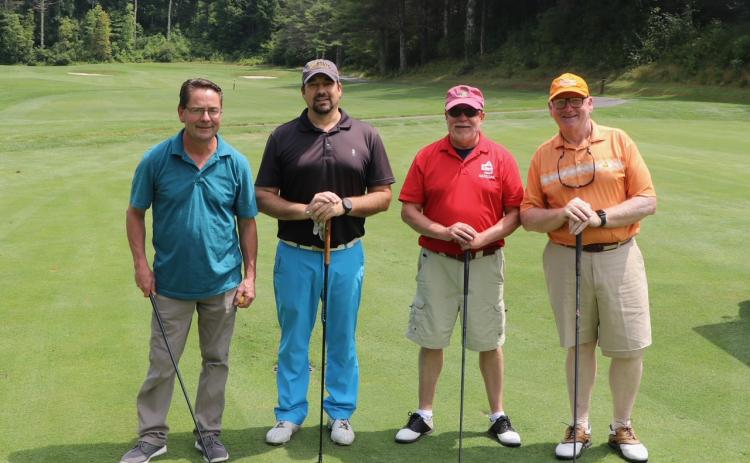 Submitted photos. The tournament team of Ron Barteski, Luke Fogarty, Dan Magliota and Chris Pence are ready to tee off at the next hole at the Sky Valley Country Club. Left: Ken Walton, Vickie Heher and Patrick Heher watch as Roberta Walton lines up her putt during the Sid Weber Memorial Cancer Fund Annual Golf Tournament. Ken Walton is the current SWMCF president.