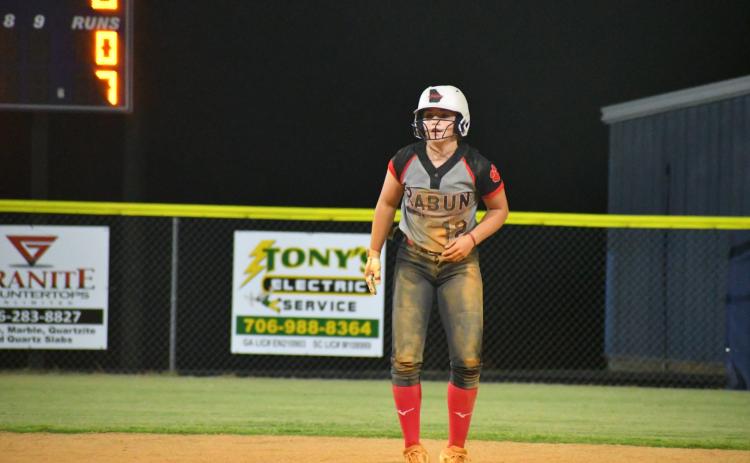 Wade Cheek The Clayton Tribune. RCHS shortstop Mili Watts taking a healthy lead at second base against Elbert County on Tuesday night.