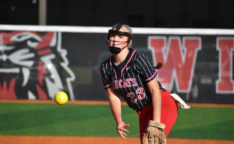 Wade Cheek/The Clayton Tribune. Pitcher Presley Burrell pitches a one-run complete game against Gainesville High School Tuesday evening as she struck out four Red Elephants.