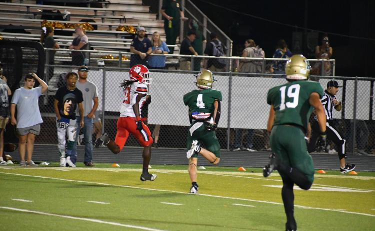 Wade Cheek/The Clayton Tribune. Rabun County defensive back Willie Goodwyn escapes from Adairsville defenders en route to scoring his first touchdown in last Friday's 35-20 victory over the Tigers.