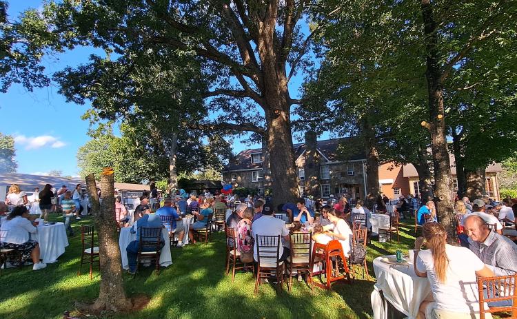 Megan Horn/The Clayton Tribune. Over 200 people were fed at The Dillard House Sunday, Sept. 3 for a Labor Day cookout on the Rock House Oaklawn. Attendees enjoyed live entertainment by Hunter Grayson and many different types of food.