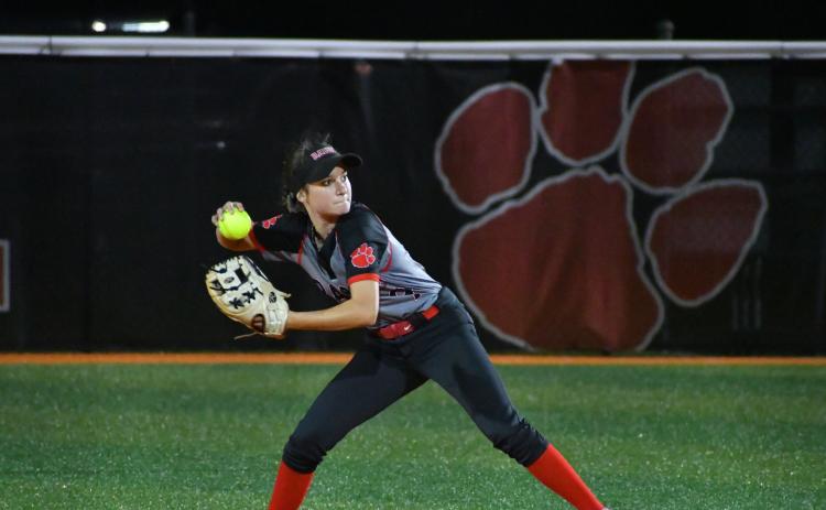 Wade Cheek/The Clayton Tribune. Lady Cat second baseman Hailey Harvey prepares to throw out a Commerce baserunner .
