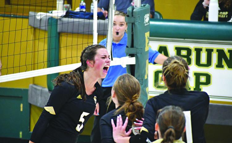 Wade Cheek/The Clayton Tribune. Eagle senior Peyton Brady (5) screams with her teammates while celebrating an Rabun Gap-Nacoochee point against Rabun County on Aug. 31. RGNS currently is ranked No. 7.
