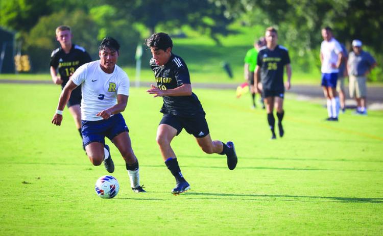 RGNS Athletics. RGNS sophomore Gabriel Ruelas races to the penalty area against TC Robertson on Aug. 22.