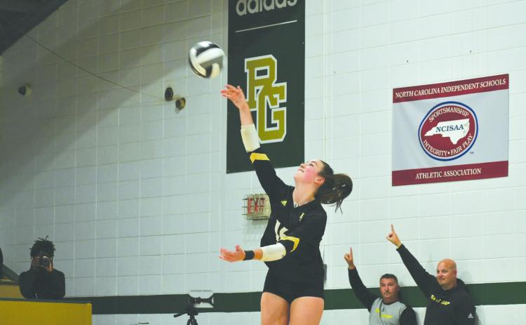 Wade Cheek/The Clayton Tribune. Eagle volleyball senior Sophia McNabb serves to Charlotte Latin School last Thursday in the second round of the NCISAA state playoffs. McNabb was named to this year’s CAA All-Conference list.