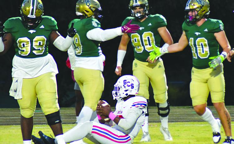 Enoch Autry/The Clayton Tribune.  RGNS’s Ezra Burress (10) celebrates one of the team’s total 11 sacks of Greenville Christian’s QB Jaylen Bester with teammates Terry Nwabuisi-ezeala, Tank Carrington and Hector Gonzaleza.