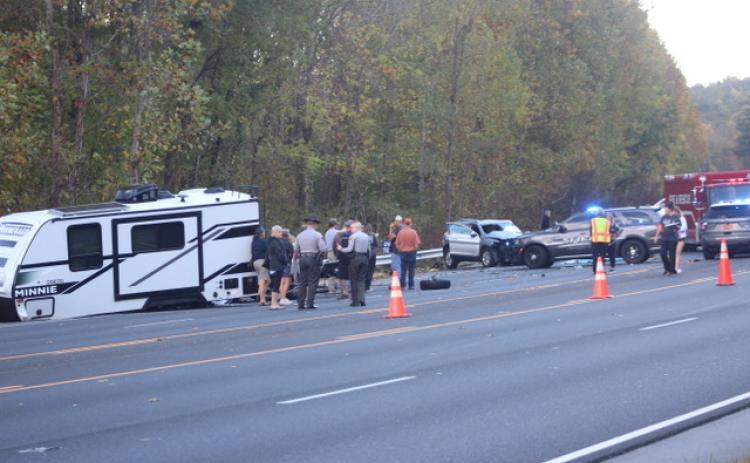 Thomas Sherrill/The Franklin Press. Emergency personnel from North Carolina work the scene of a four-vehicle crash with one fatality and other injuries on Georgia Road in Otto, N.C., Friday, Oct. 20. The scene left extensive damage on the roadway. The North Carolina State Highway Patrol is investigating the crash that caused traffic to back up as the road was closed for over four hours.