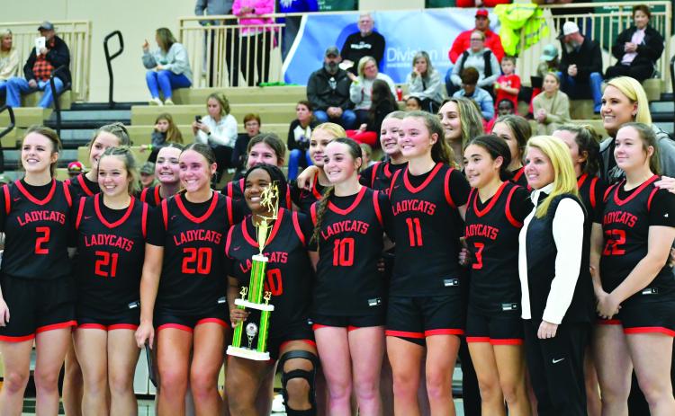 Wade Cheek/The Clayton Tribune. The Rabun County Lady Cats hoist the trophy from the Piedmont University Hardwood Classic after defeating Class AA Union County 82-80 as RCHS came back from being 19 points behind. The Lady Cats were led in the game by senior Lucy Hood who scored 41.