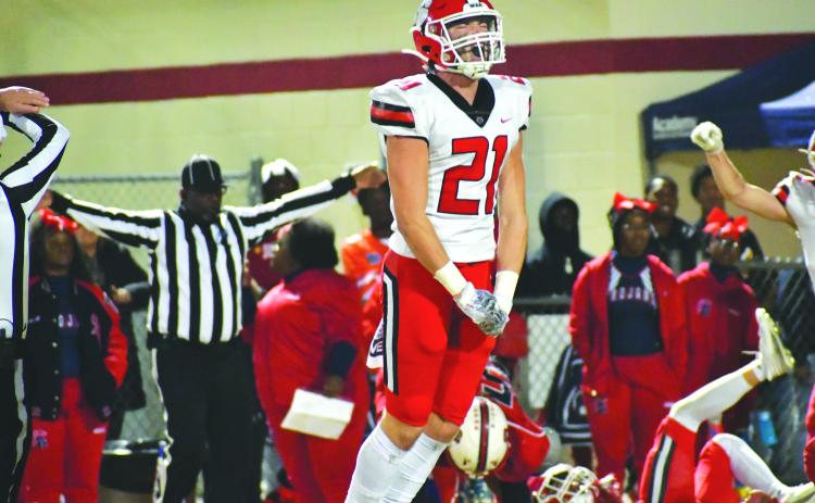 Wade Cheek/The Clayton Tribune. RCHS senior Paul Picciotti reacts to his Wildcats making a defensive stop in the quarterfinals against Brooks County.
