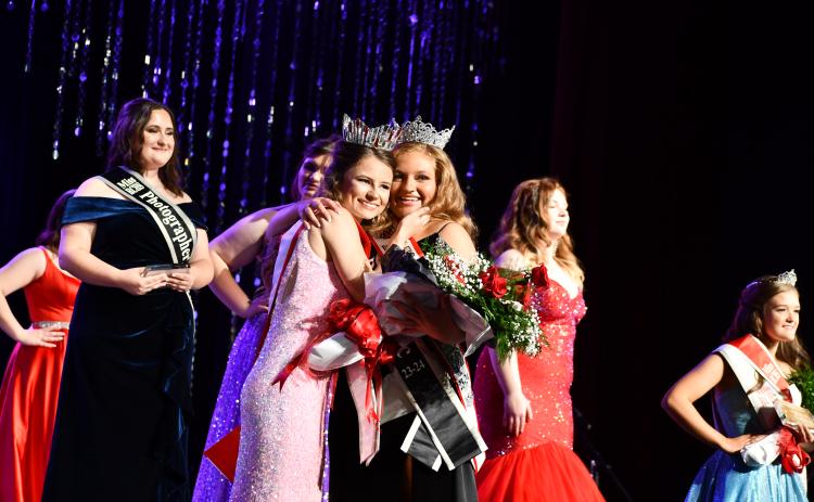 Megan Horn/The Clayton Tribune. Ashlynn York Blackwell is crowned 2023-2024 Miss RCHS at the Oct. 28 Scholarship Pageant. Miss RCHS 2022-2023 Rainny Marie Ramey presents Blackwell with her crown, sash and flowers.