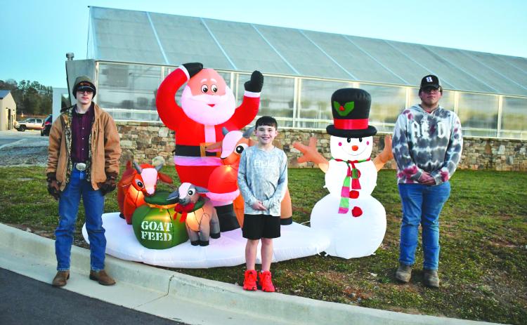 Megan Horn/The Clayton Tribune. FFA member Preston Patterson, Cayden McClain and FFA member Garrett Craig were among those who were in attendance at the Dec. 7 first-ever “Santa and Elves on the Farm” at the agricenter.