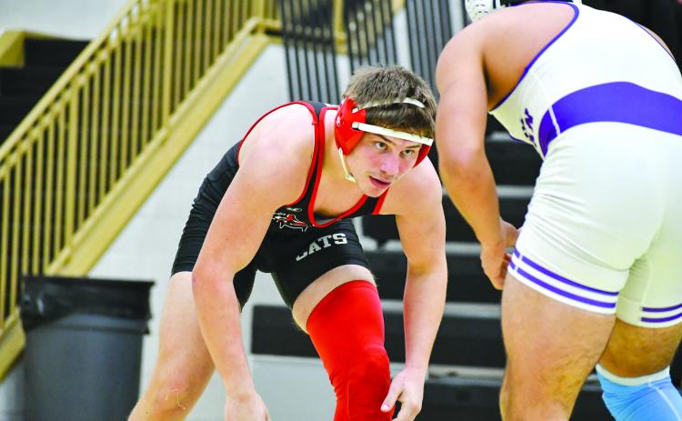 Wade Cheek/The Clayton Tribune. RCHS grappler Celton Littrell sizes up his Athens Christian opponent during last weekend’s area duals match on Jan. 13. The 175-pounder won the match, helping the Wildcats go 2-2 throughout the day after defeating the Eagles and area opponent Towns County.