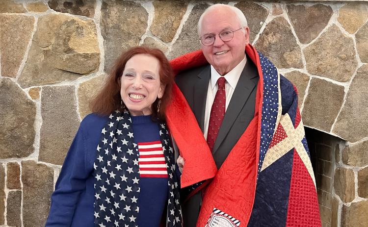 Photo courtesy of Tallulah Falls School. At the Tallulah Falls School January Board of Trustees meeting, board member Alice Cookie Noel, a member of the Quilts of Valor committee for South Central Georgia and for the Lake Oconee Quilt Guild, presented President and Head of School Dr. Larry A. Peevy with a quilt created by Kathy Henderson, a member of the Lake Oconee Quilt Guild.