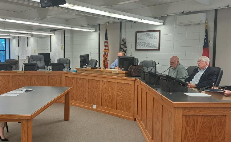 Megan Horn/The Clayton Tribune. Council member Amanda Harrold (far left) speaks to Clayton City Ethics Committee members Broderick Crawford, Carl Butler and Libby Jones Farley; and City Attorney Mitch Baker during Tuesday’s public hearing.