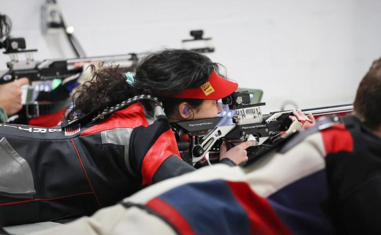 TFS Athletics. TFS senior marksman Brianna Walter lines up a shot during one of the TFS rifle team’s matches this past season.