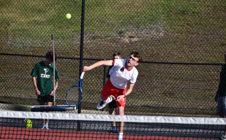 Wade Cheek/The Clayton Tribune. Wildcat Robbie Fountain serves.