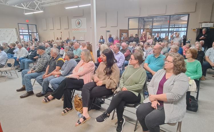 Megan Horn/The Clayton Tribune. It was standing room only in the Food Bank of Northeast Georgia Community Room April 11 as over 100 people attended a question and answer forum for Board of Commissioner and Clerk of Court candidates, co-hosted by Rabun County Republicans and The Clayton Tribune with Publisher Enoch Aury moderating.