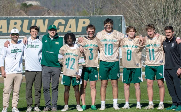 Wade Cheek/The Clayton Tribune. RGNS across head coach Ryne Linsley and the RGNS coaching staff stands with the Class of 2024 during Senior Night on Friday, April 5. The lacrosse Class of 2024 includes Huseyin Simsir, Danny Beccan, Will Brien, Cael Woody and Jack Moores.