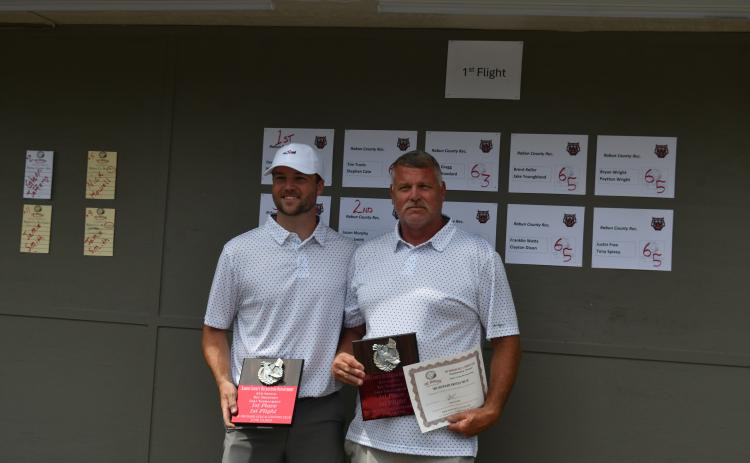 Wade Cheek/The Clayton Tribune. Nick Howell (left) and Dennis Hendricks collect their first-place awards during the ninth annual golf tournament hosted by the Rabun County Recreation Department at the Orchard Golf and Country Club on Tuesday, June 18.