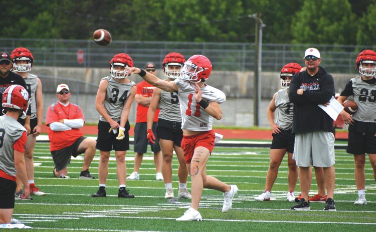 Wade Cheek/The Clayton Tribune. RCHS junior starting quarterback Ty Truelove lets it loose during a 7-on-7 practice with Hart County on June 6. Truelove underwent surgery in December after a torn labrum during the 2023 season.