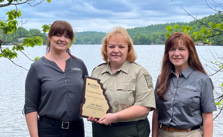 Submitted. Pictured are Michelle Egan, with the DNR Region, Amy Speed, administrative assistant at Moccasin Creek State Park, and Angie Johnson, Georgia State Parks Director. Speed recently won a statewide Customer Service Award from the Georgia Department of Natural Resources (DNR).