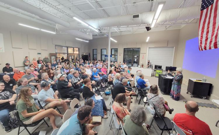 Enoch Autry/The Clayton Tribune. A total of 225 paid for Rabun County’s first-ever World UFO Conference that was held at the Food Bank of Northeast Georgia on June 29. Below: Those in attendance even donned springy antenna to salute the visitors from afar.