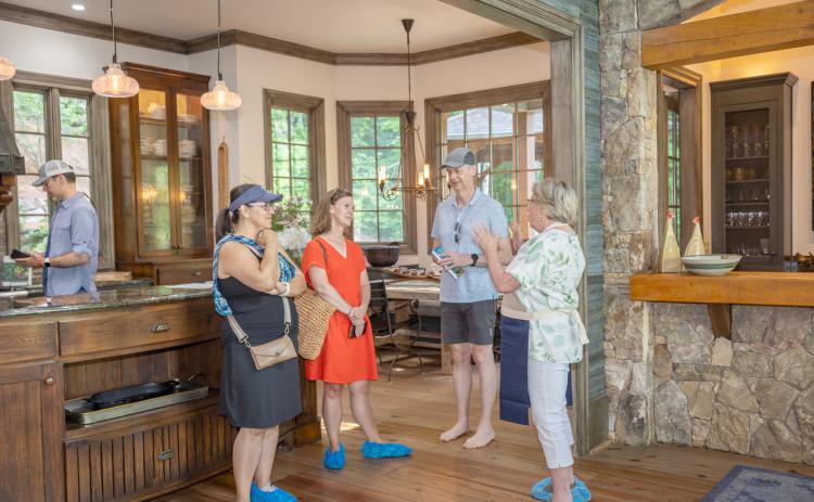Photo courtesy of Melissa Elzey. In each home, volunteers welcomed visitors and shared details about the property during the Lake Burton Tour of Homes on June 22.
