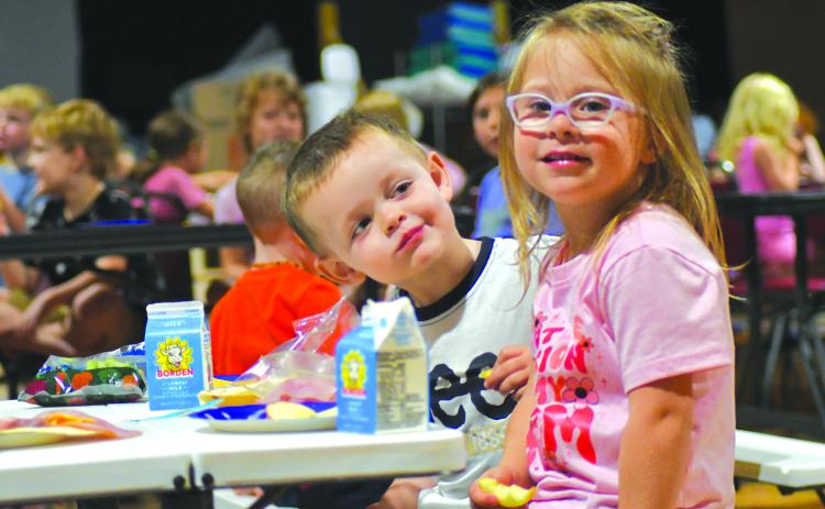 Enoch Autry/The Clayton Tribune. Gatlin Owens looks at his friend Audi Kilby during a day last week at the Mountain City Playhouse.