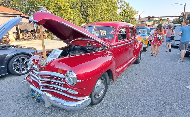 Megan Horn/The Clayton Tribune. This red classic owned by Cody Whitmire was showcased at the Downtown Clayton Block Party with a sign that read “Pharoahs Eastern Region Truckin’.”