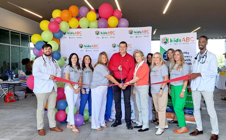 Megan Horn/The Clayton Tribune. Mountain Lakes Medical Center holds a Forward Rabun/Rabun County Chamber of Commerce ribbon cutting for KidsABC, an alliance between Children’s Healthcare of Atlanta and Mercer University, to expand healthcare access and education for children in our rural communities. The partnership is part of Mountain Lakes Medical Center’s ongoing rural healthcare community engagement program.