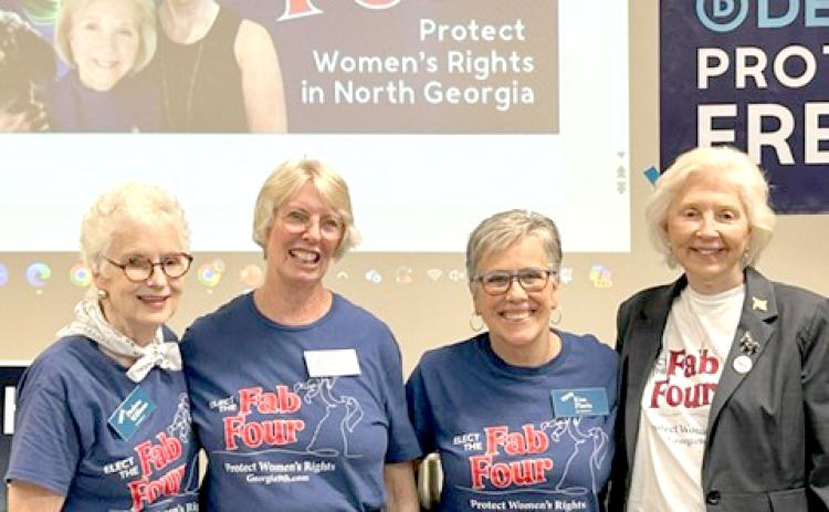 Submitted photo.  Rabun County resident Paulette Williams (left); Charlotte Sleczkowski of Towns County; Kim Floria of Hall County; and June Krise of White County were welcomed by a packed crowd Monday, Sept. 9, in the community room of the Food Bank of Northeast Georgia.
