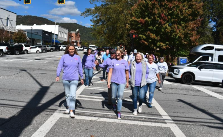 File/Megan Horn/The Clayton Tribune. Fight Abuse in the Home (F.A.I.T.H.) has many events planned for October during Domestic Violence Awareness Month. Pictured are community members participating in last year’s Hope Walk where they wore purple and walked through downtown Clayton while local businesses stood in solidarity holding candles on the sidewalk to bring awareness. This year’s Hope Walk is scheduled for Wednesday, Oct. 2, around 11:30 p.m. at The Rock House, 39 E Savannah Street, Clayton.