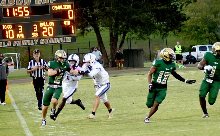 Enoch Autry/The Clayton Tribune. Rabun Gap-Nacoochee’s Walker Bryson takes it down the sideline on the opening kickoff to put the Eagles up 7-0 in their Homecoming win.