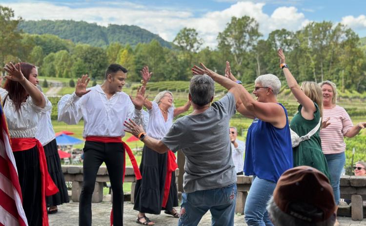 Submitted photo. The Rabun Entertainers as well as guests at the event dance to Italian-themed Harvest songs.