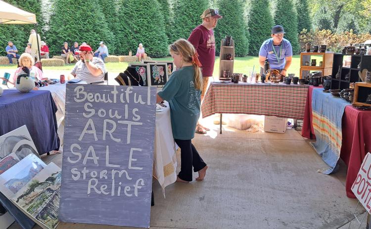Megan Horn/The Clayton Tribune. Since the Foxfire Mountaineer Festival was held the weekend after Hurricane Helene, many crafters set up ways attendees could help storm victims during their time of need. Below: Submitted photo from the Foxfire Mountaineer Festival.