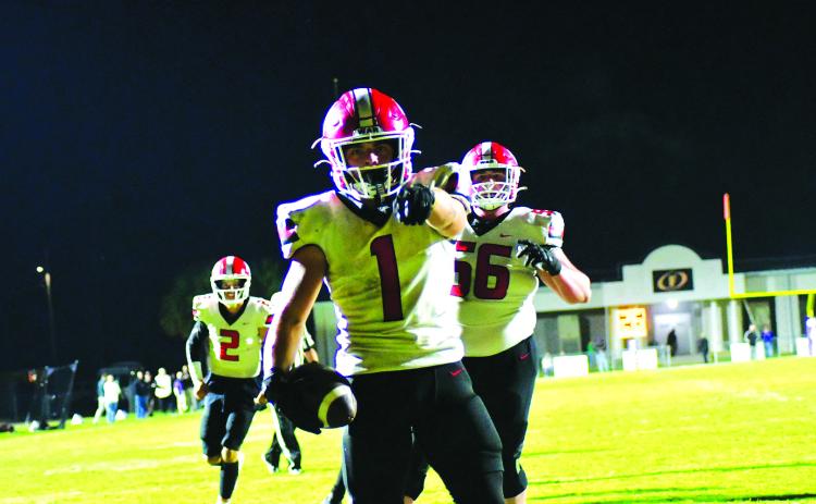 Enoch Autry/The Clayton Tribune. Junior Wildcat running back Lake Evans scores his first of two touchdowns on the road in the first round of the state football playoffs in Fitzgerald. The Purple Hurricane would prevail, 42-21.