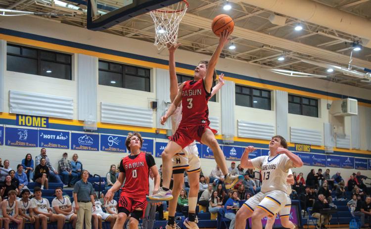 Wade Cheek/The Clayton Tribune. RCHS sophomore guard Huey Blalock scored 22 points in the Wildcats season-opening win over Highlands School on Nov. 14. The Rabun boys are currently 2-0 and ranked eighth in Class 1A-Division I.