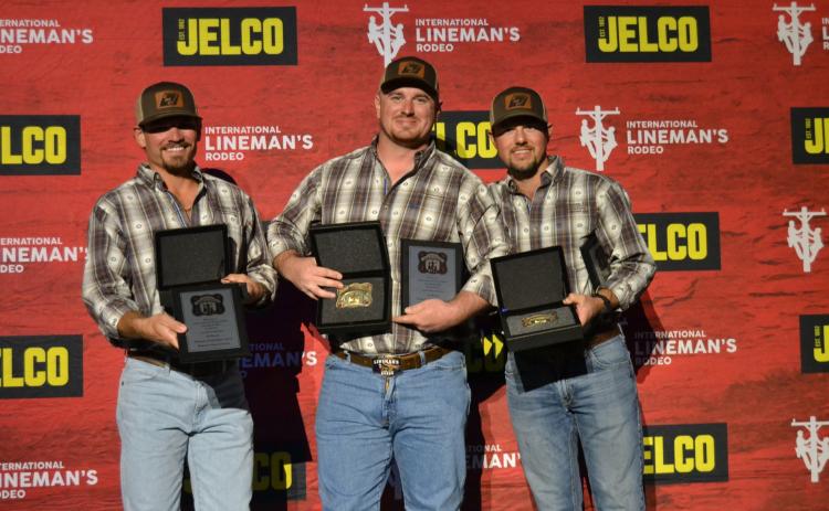 Submitted photo. HEMC linemen Dillon Welborn (left) Robert Morris, and Tucker Dyer stand with their awards.