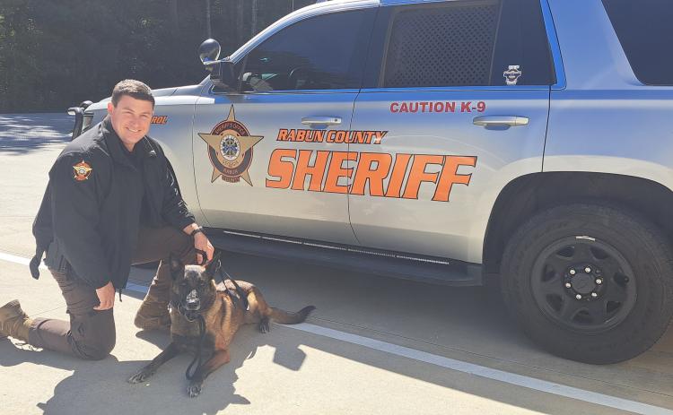 Megan Horn/The Clayton Tribune. K9 Doug retired from the RCSO on Oct. 1 at the age of 8. Pictured with Handler Sgt. Brandon Hyer, the pair worked as partners for seven years to seize pounds of narcotics.