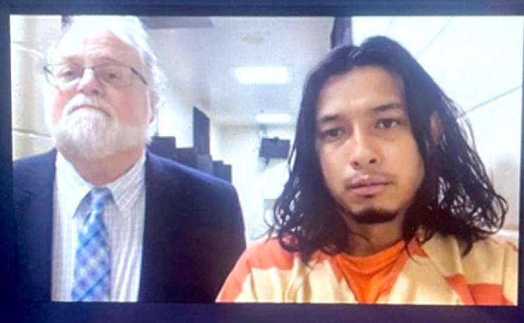 Submitted photo. Angel DeJesus Rivera-Sanchez (right) appears with Public Defender Drew Powell in Habersham County Magistrate Court on Nov. 1 in this video screenshot.