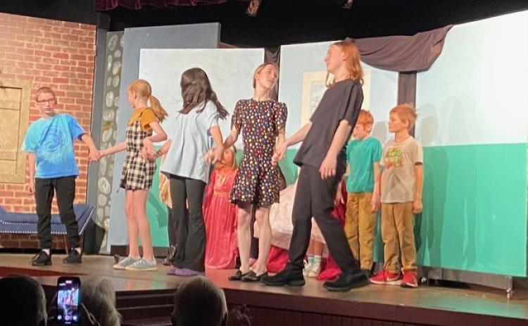 Submitted photos.  Students ages 6 to 15 performed at the North Georgia Community Players Youth Theatre Program on stage Sunday, Nov. 24. Youth Program participants are Luke Arnett, Lucy Arnett, Abbie Boggs, Linus Freeman, Johnna Haas, Louisa Loveland, Dylan Mason, Maela Radcliffe, Antonella Singleton, Harriet Wheatley and Leo Wheatley. Below: Louisa Loveland, Leo Wheatley and Maela Radcliffe participate in the North Georgia Community Players Youth Theatre Program and perform “The Big Show” on stage Nov. 24